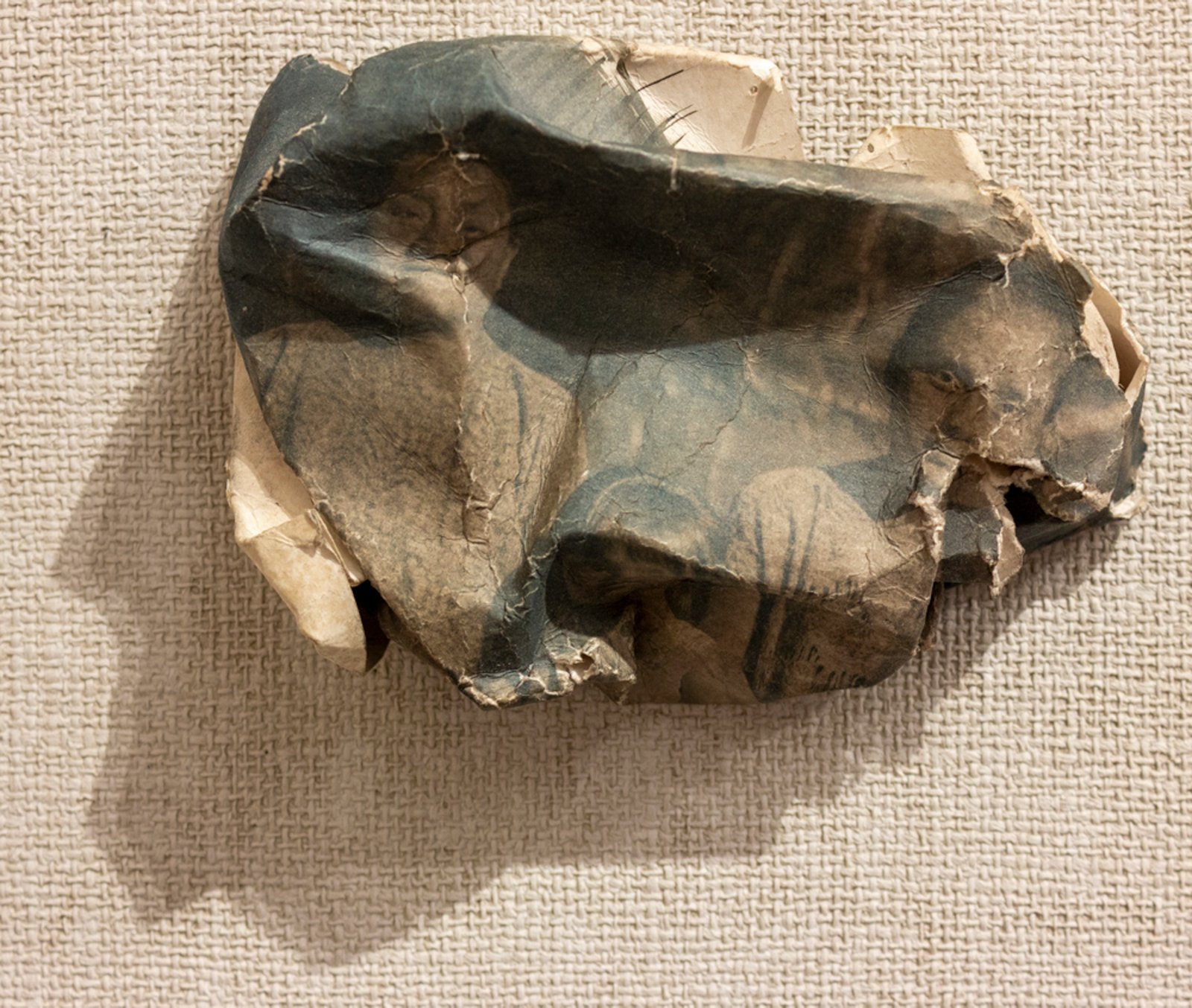 Crumpled cyanotype paper object — small sculptural relic