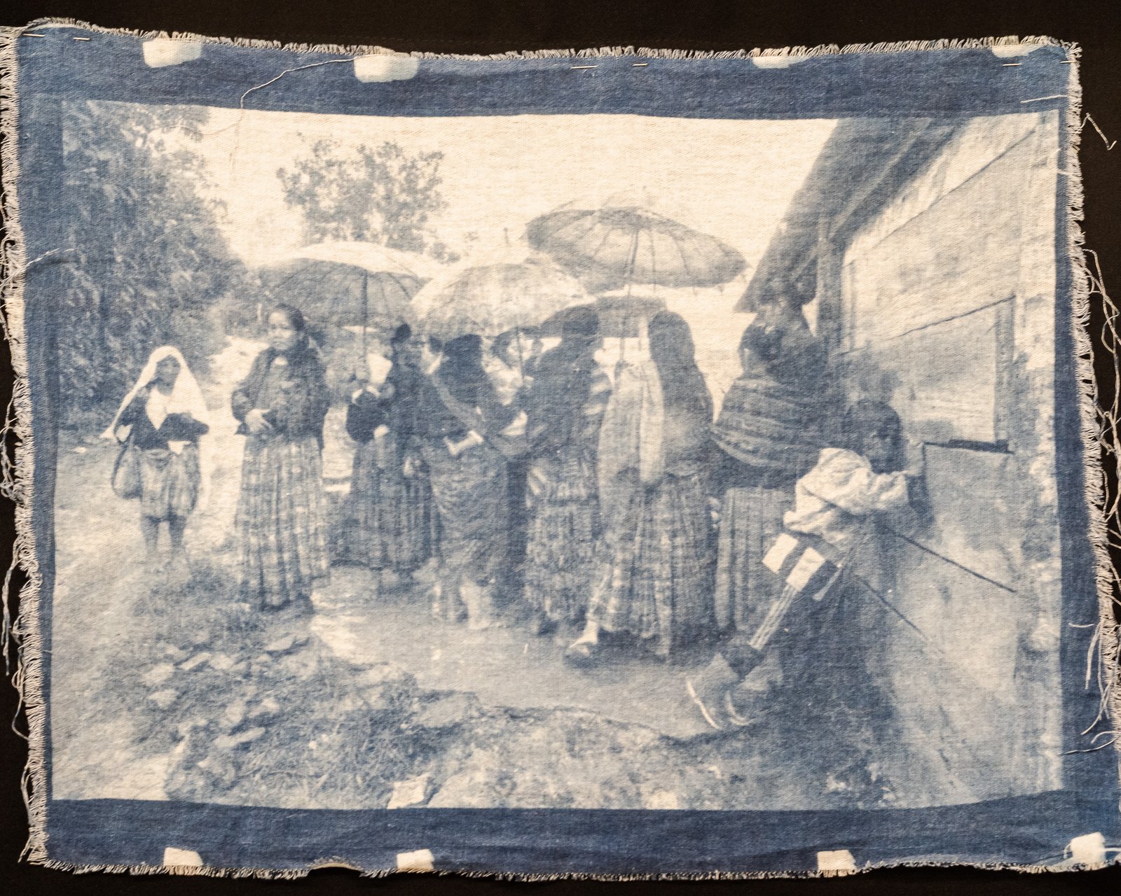 A garment hanging on a wall — cyanotype on cotton